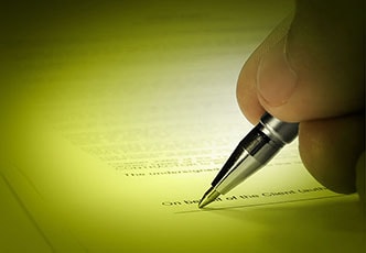 pen signing a document